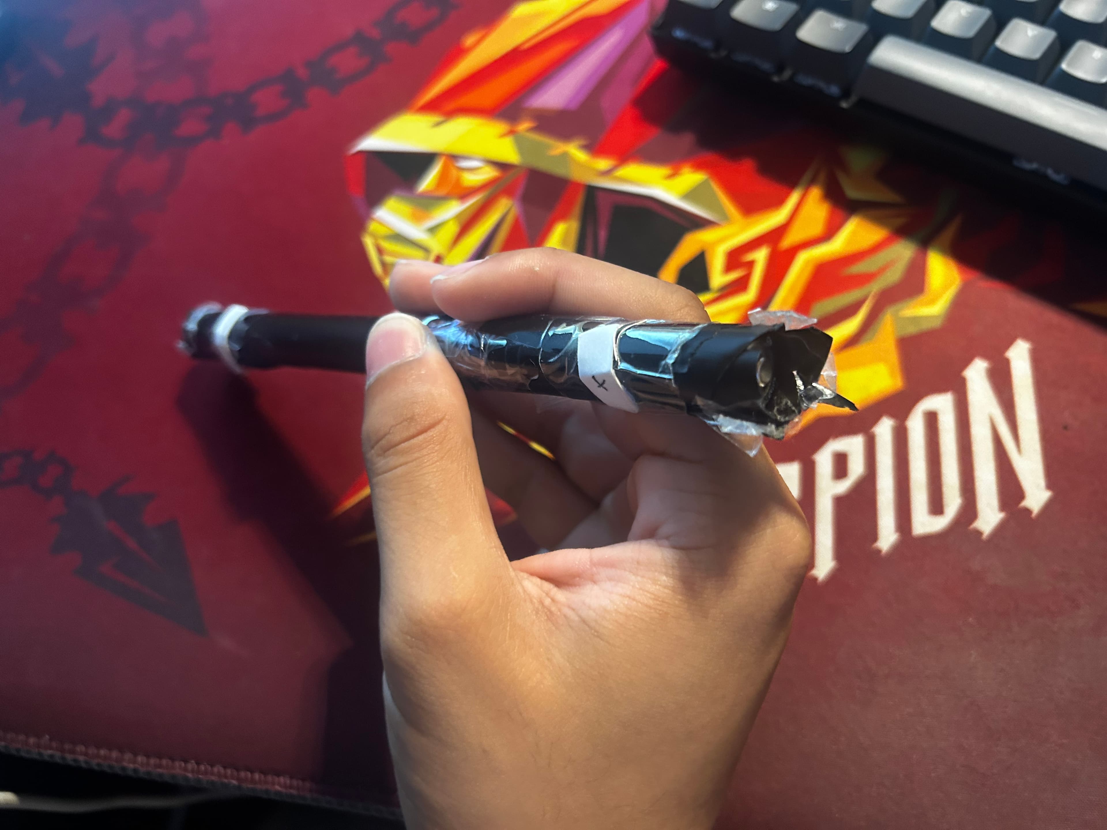Our makeshift battery holder using a bubble tea straw